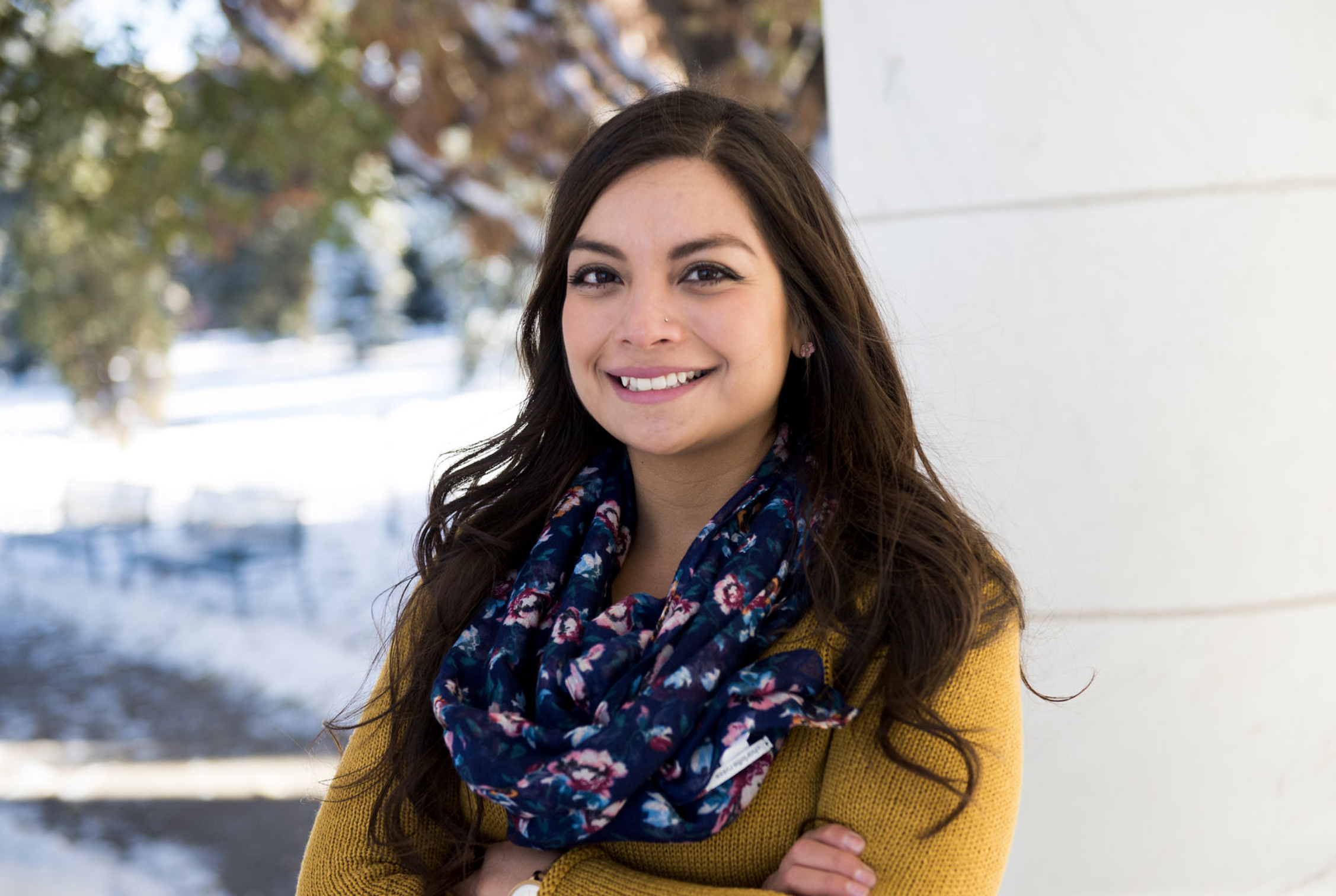 headshot of Samantha Ortega. A hispanic woman standing outside with long brown hair.