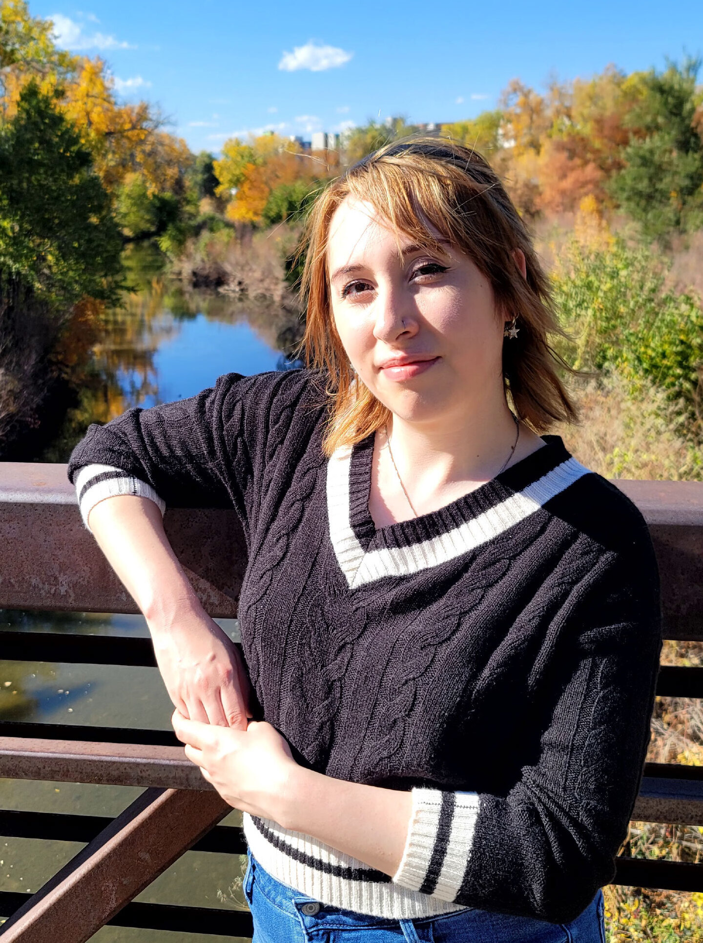 GO Smart Coordinator Kelsey Foster standing on a bridge outside posing for the photo.