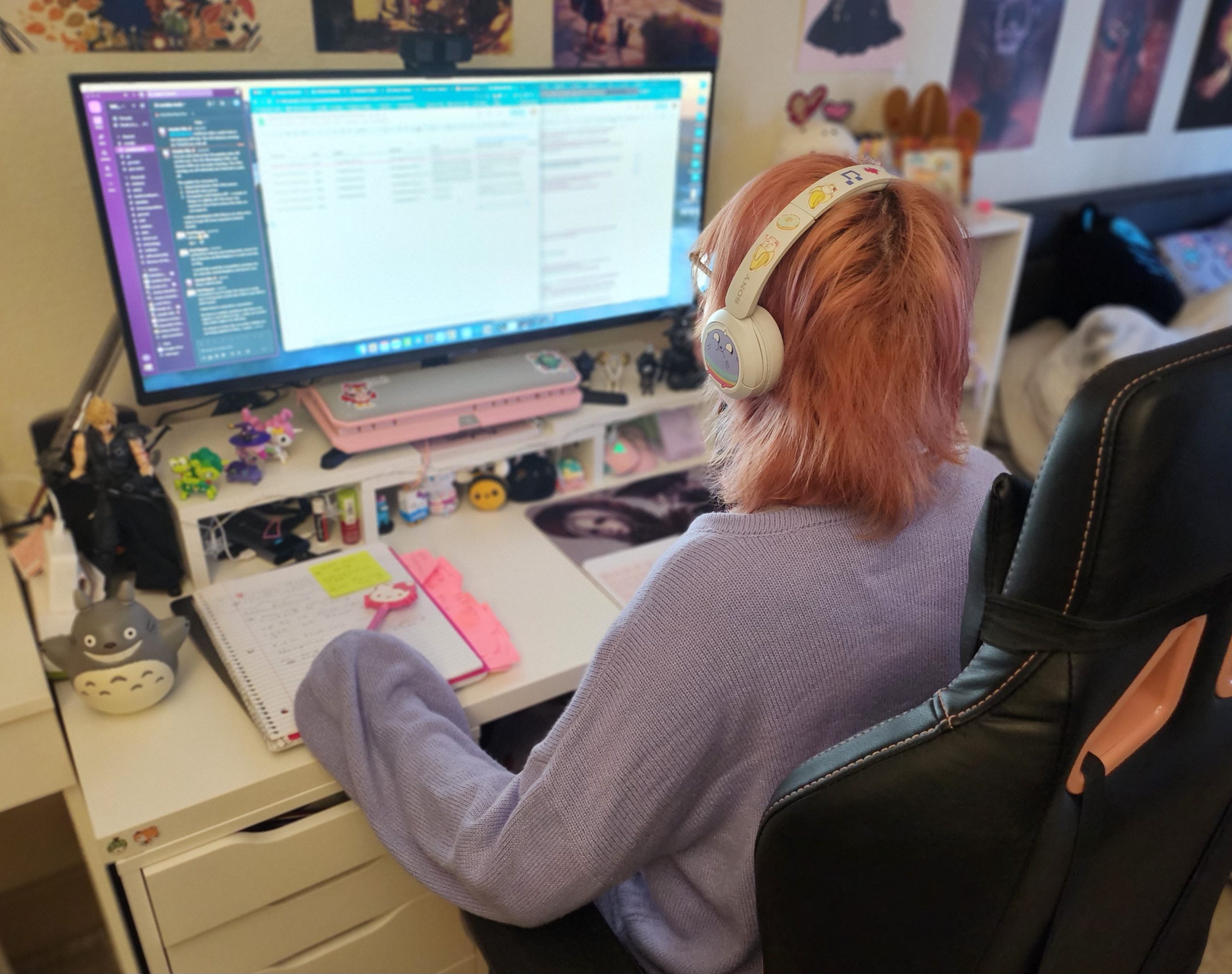 Kelsey Foster sitting at her work desk on the computer.