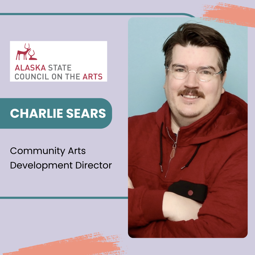 A portrait of Charlie Sears, a man with light brown hair and glasses, wearing a red hooded jacket, smiling. He is identified as the Community Arts Development Director. The background is pale blue with a pastel purple border.